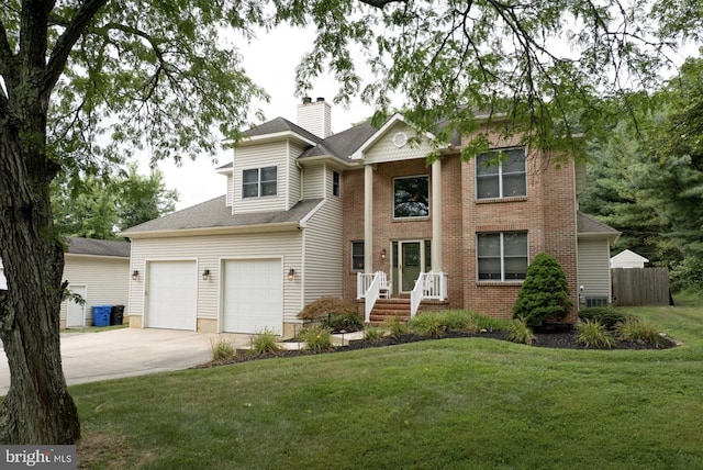 view of front of house with a garage and a front lawn