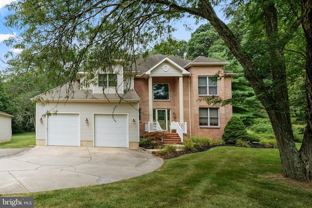 view of front of property with a garage and a front yard