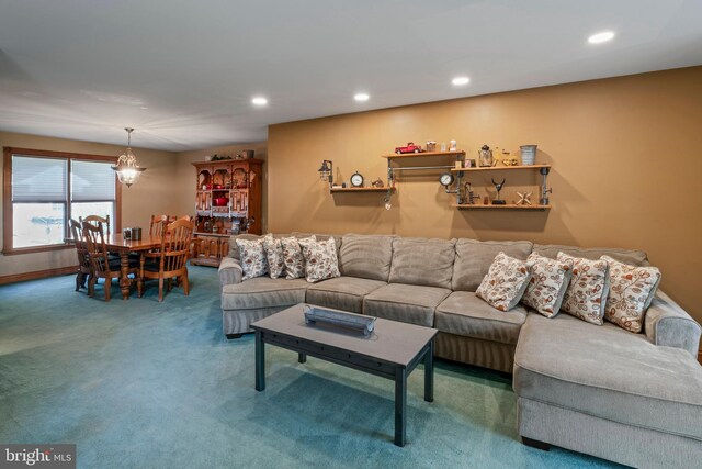 living room featuring carpet and a notable chandelier