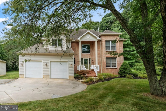 view of front of house featuring a front yard and a garage