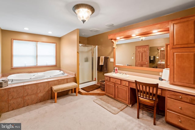 bathroom featuring plus walk in shower and vanity