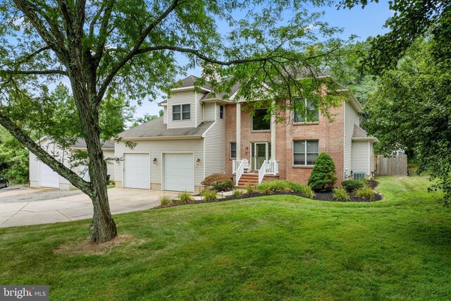 view of front of home featuring a garage and a front lawn