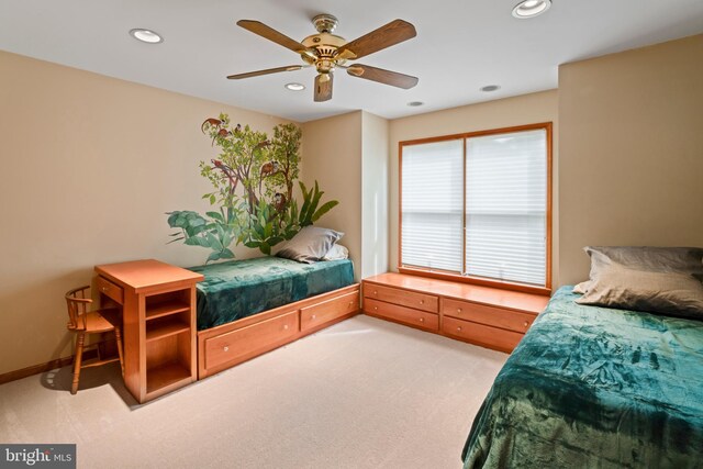 carpeted bedroom featuring ceiling fan