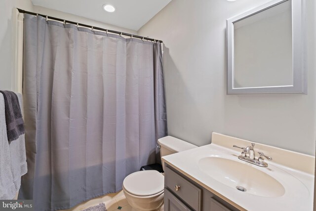 bathroom with toilet and vanity