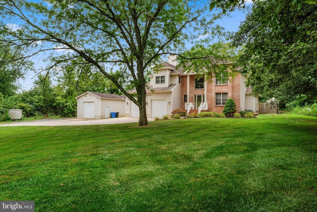 view of front of house featuring a front yard and a garage