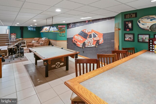 game room featuring tile patterned flooring, pool table, and a drop ceiling