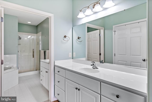 bathroom featuring vanity, tile patterned floors, and separate shower and tub