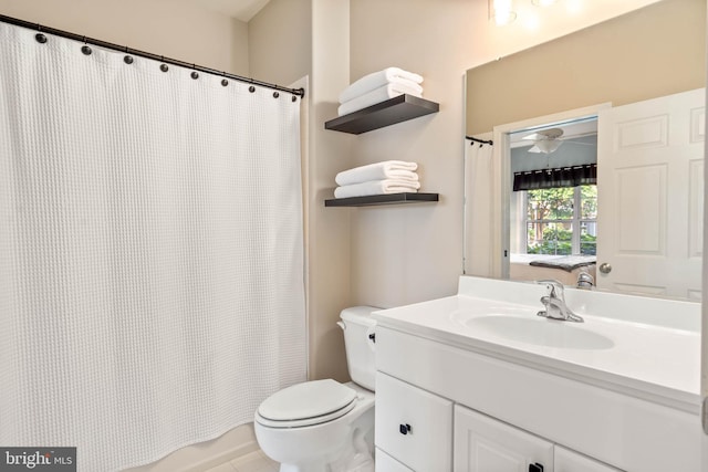 bathroom with vanity, toilet, and a shower with shower curtain