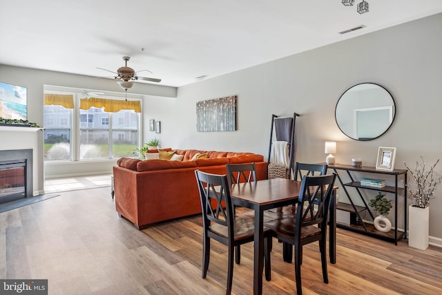 dining room featuring ceiling fan and light hardwood / wood-style flooring