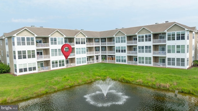 view of property with a water view