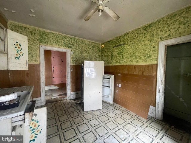 kitchen with electric range, light tile patterned floors, and ceiling fan