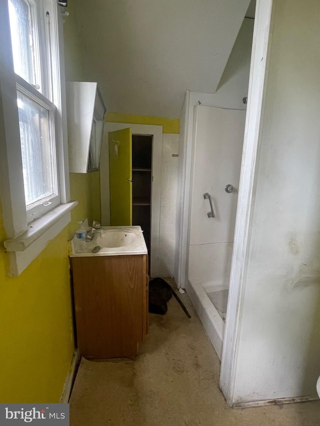 bathroom featuring vanity and walk in shower