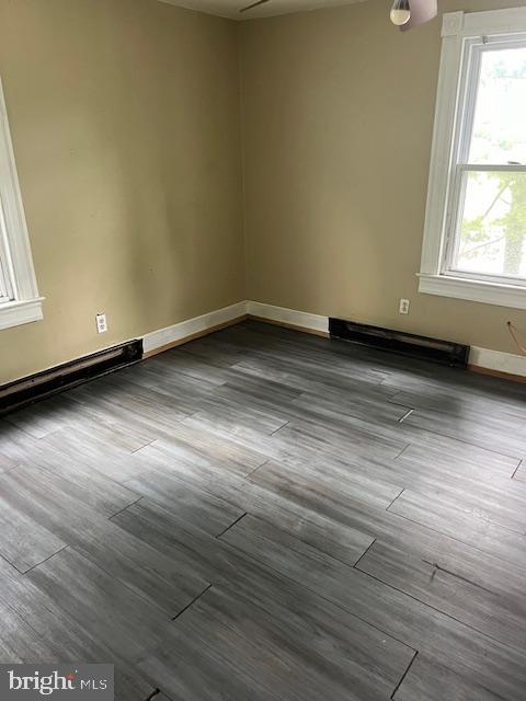 unfurnished room featuring wood-type flooring