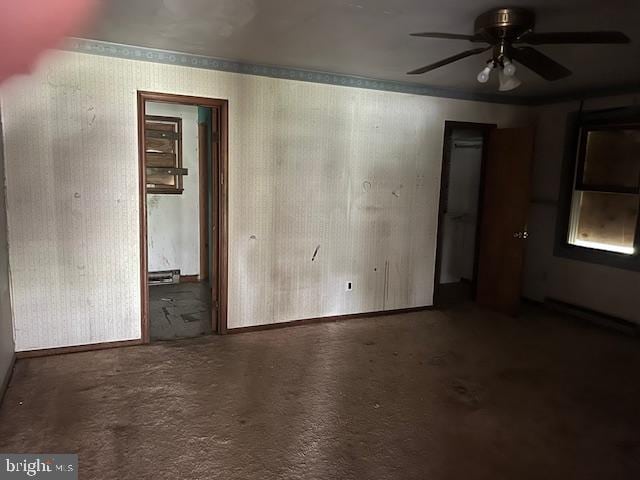 unfurnished room featuring concrete flooring and ceiling fan