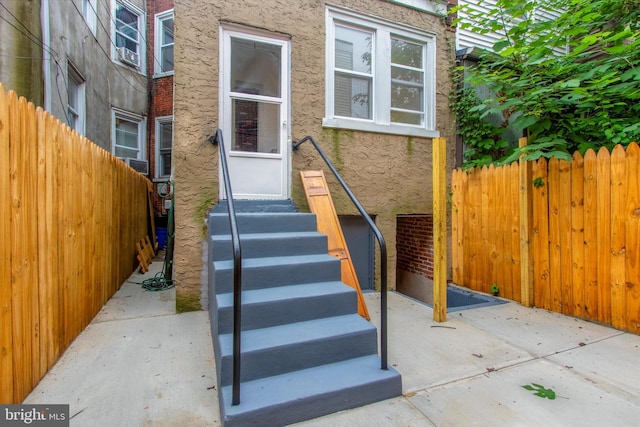 entrance to property featuring a patio