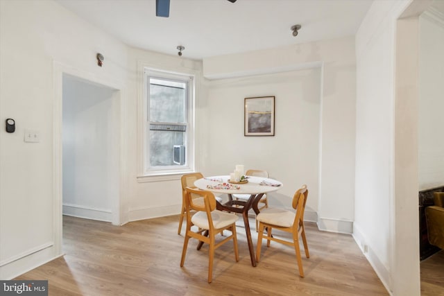 dining area featuring light wood-type flooring