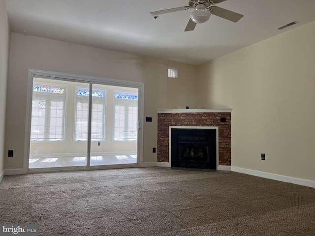 unfurnished living room with carpet floors, a healthy amount of sunlight, and ceiling fan