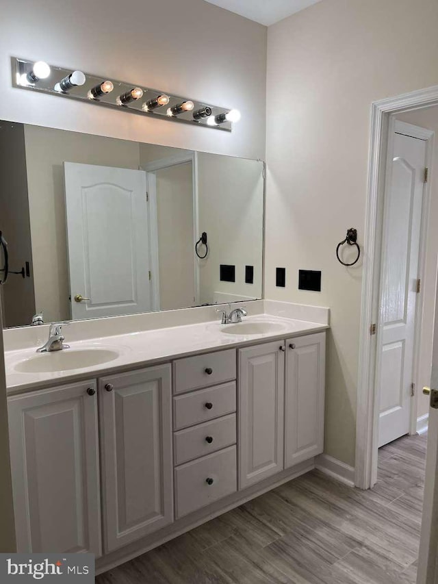 bathroom featuring vanity and hardwood / wood-style floors