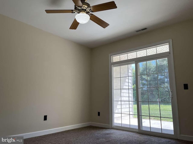 doorway to outside with ceiling fan and carpet