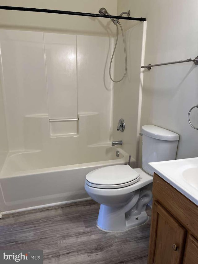 full bathroom featuring shower / tub combination, vanity, toilet, and hardwood / wood-style floors