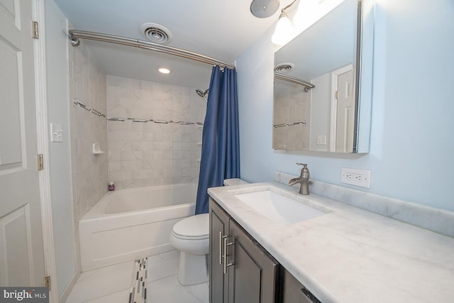 full bathroom with vanity, shower / bath combination with curtain, and toilet