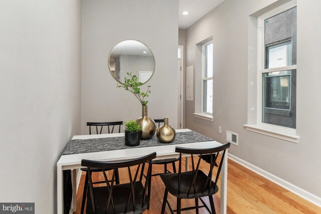 dining space featuring hardwood / wood-style flooring