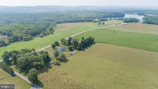 aerial view with a rural view and a water view