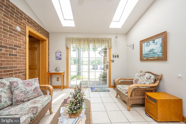 tiled living room featuring brick wall and lofted ceiling with skylight