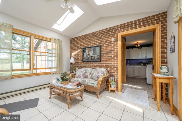 tiled living room featuring a baseboard radiator, ceiling fan, brick wall, and vaulted ceiling with skylight