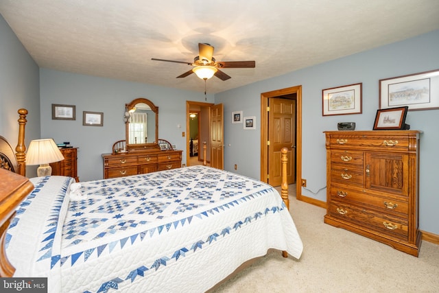 bedroom with light colored carpet and ceiling fan