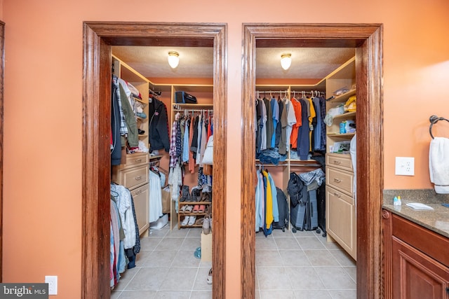 walk in closet featuring light tile patterned floors