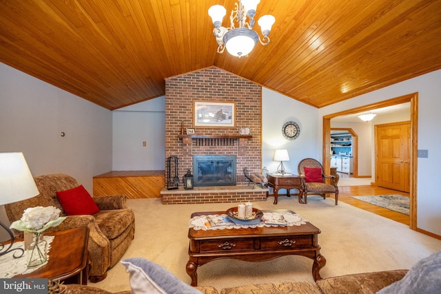 carpeted living room featuring vaulted ceiling, a fireplace, brick wall, wooden ceiling, and a notable chandelier