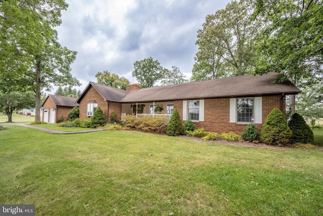 ranch-style home featuring a front yard