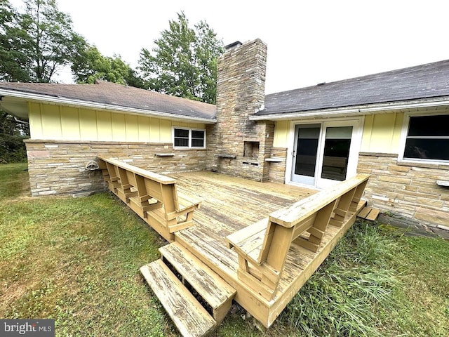 wooden terrace with a lawn