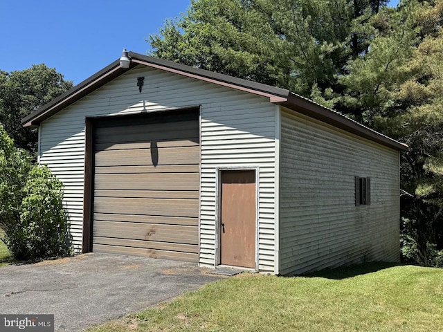 garage with a yard