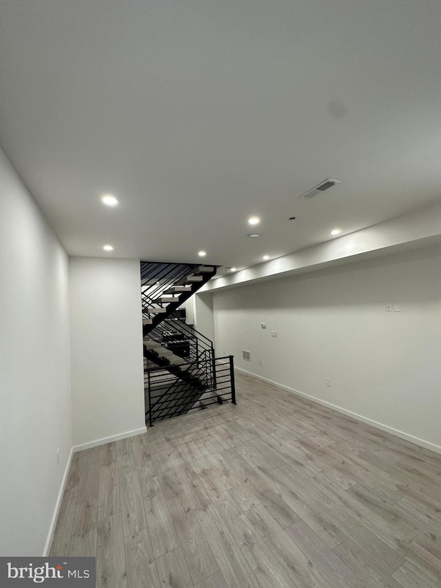 basement featuring light wood-type flooring