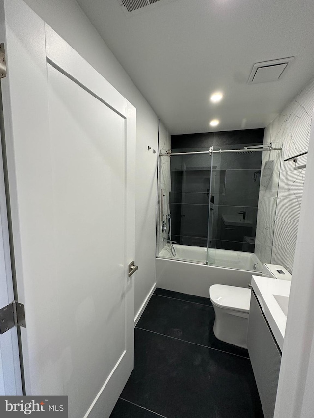 full bathroom with vanity, tile patterned flooring, toilet, and combined bath / shower with glass door