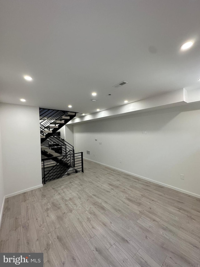 basement featuring light hardwood / wood-style flooring