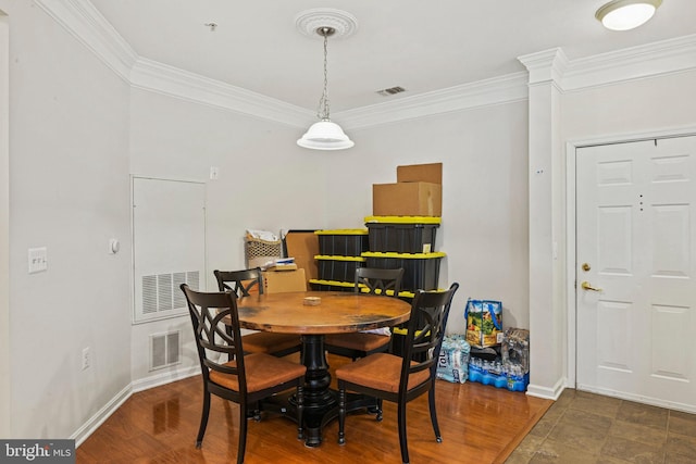 dining room featuring ornamental molding