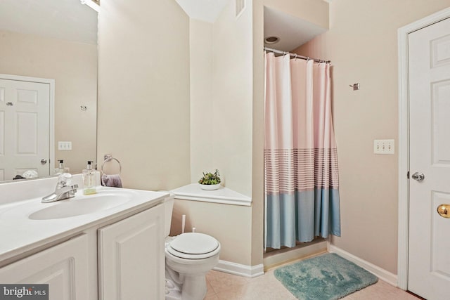 bathroom with toilet and vanity