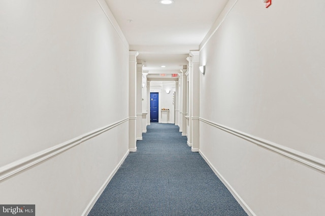 corridor with carpet flooring and crown molding