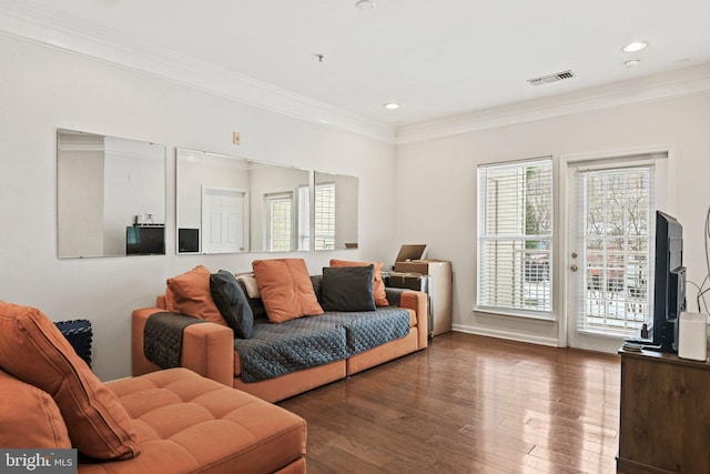 living room with dark hardwood / wood-style floors and crown molding