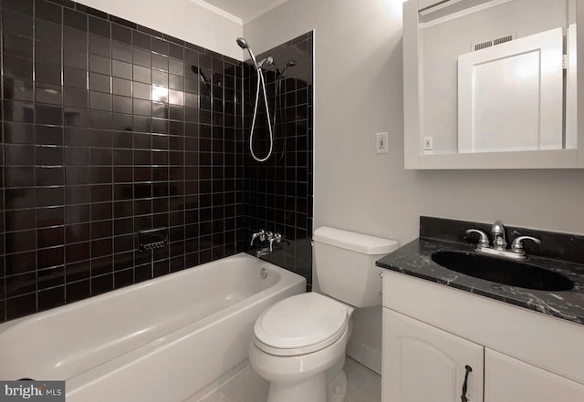 full bathroom featuring vanity, tiled shower / bath combo, crown molding, and toilet