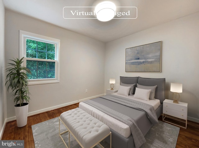 bedroom featuring dark wood-type flooring