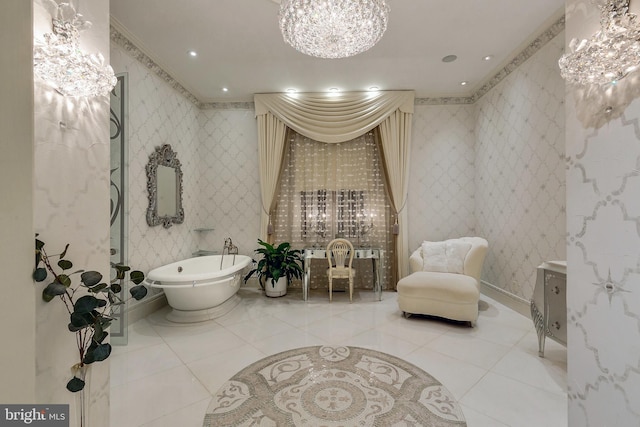 bathroom with a notable chandelier, a bathing tub, vanity, and crown molding