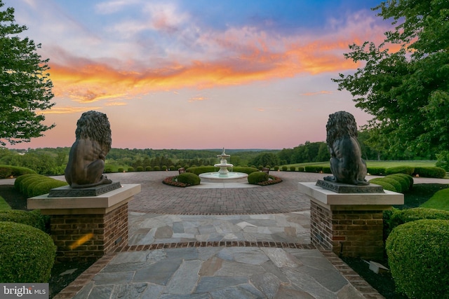 view of patio terrace at dusk