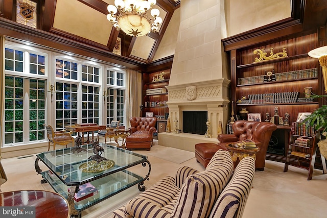 living room with a tile fireplace, high vaulted ceiling, ornamental molding, and a chandelier