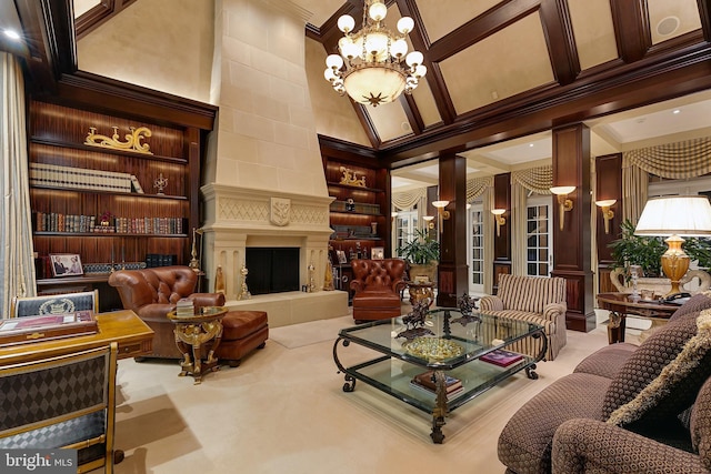 living room with ornate columns, a chandelier, high vaulted ceiling, built in features, and a tile fireplace