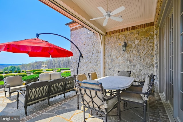 view of patio featuring an outdoor living space and ceiling fan