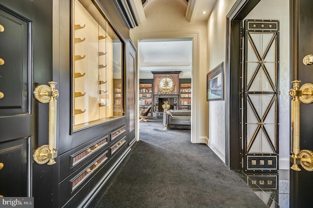 hallway featuring dark colored carpet